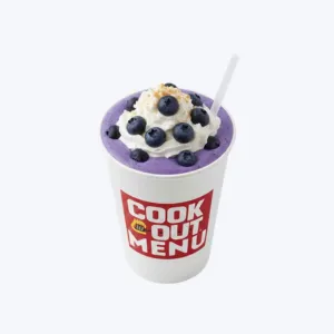 Cookout Blueberry milkshake in a tall cup